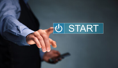 man holding phone with start icon