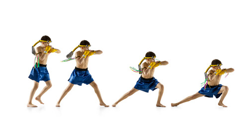 Fototapeta na wymiar Little boy exercising thai boxing on white background. Fighter practicing, training in martial arts in action, motion. Evolution of movement, catching moment.