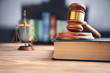 Judge gavel, scales of justice and law books
