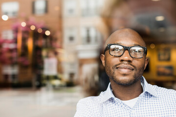 Black man looking out window