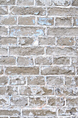 Old brick wall. Ancient stone texture background. Urban background, white ruined industrial brick wall with copy space. Home and office design backdrop. Vintage effect. Vertical photo