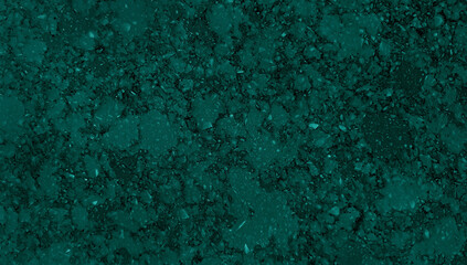 Fototapeta na wymiar macro view of green grain granite stone texture with crystal pigments use as a background. dark turquoise artificial stone background for interior material ,countertop or tabletop finishing.