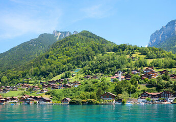 Fototapeta na wymiar beautiful tourist resort Merligen, lake shore of Thunersee, Berner Oberland, switzerland