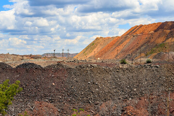 View of slag heaps of iron ore quarry. Mining industry