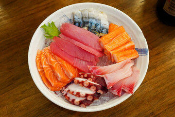 Sashimi in a large white cup