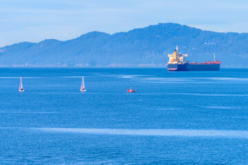 Fantastic view over ocean, yacht and snow mountains in Vancouver, Canada.