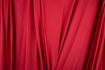 Texture, background, template. Silk fabric. Red silk drapery and upholstery fabric. Solid fabrics for backdrop, drapes, flags and curtains