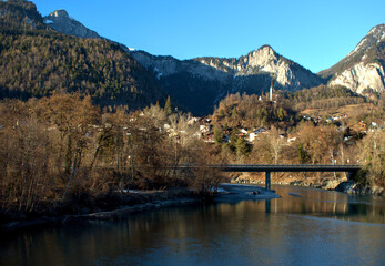 Fototapeta na wymiar Beautiful natural scenery at the rhine river in Tamins in Switzerland 20.2.2021