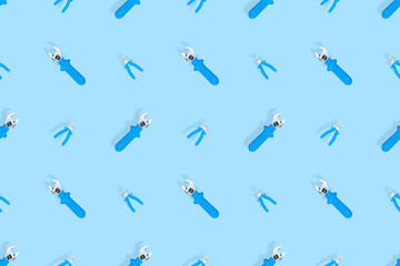 Tools seamless pattern. Background made of tools, pliers and an adjustable wrench.