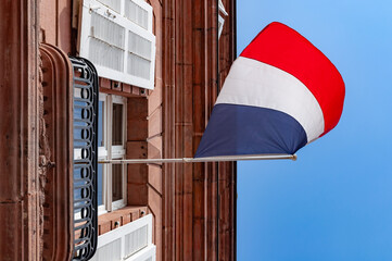 Naklejka premium Wissembourg, France. September 13th, 2009. A French flag flies from the city hall.