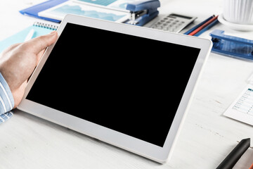 businessman with a tablet, works in the office