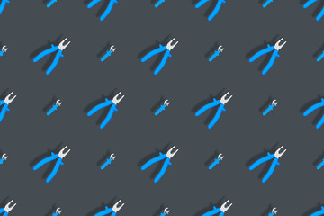 Fototapeta premium Tools seamless pattern. Background made of tools, pliers and an adjustable wrench.