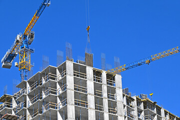Crane and highrise construction site