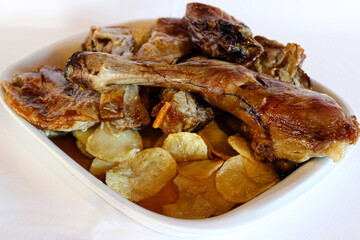 Spanish-style roast lamb with potatoes