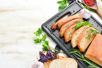 Fragrant Italian ciabatta with rosemary. Bread. Baking from rye and flour. Top view. Rustic style.