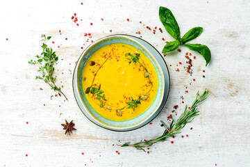 Pumpkin soup with pumpkin seeds. Autumn food. Top view. Rustic style.