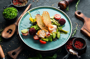 Salad with salted fish, cheese and vegetables. Top view. Rustic style.