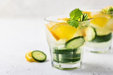 Summer citrus refreshing mojito cucumber orange iced drink. Space for text.