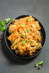 Stewed chicken with vegetables  in cast iron skillet. Space for text.