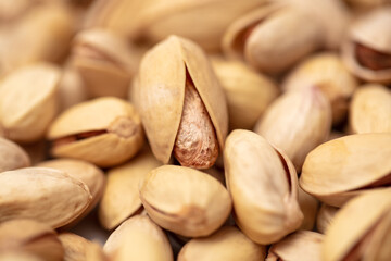 Close-up of fresh pistachio nuts as background.