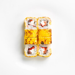 Traditional sushi rolls with cheese. Japanese food. Top view. On a white background.