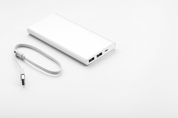 Fototapeta premium Gray Power Bank on white background free space