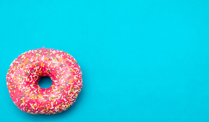 Red donut on a blue background.