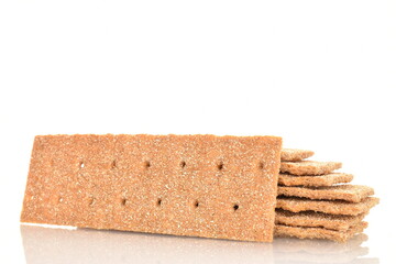 Several multigrain thin crisps, close-up, isolated on white.