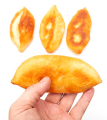 Pie with cabbage in hand isolated on white background.