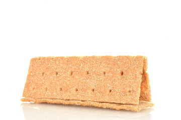 Several multigrain thin crisps, close-up, isolated on white.