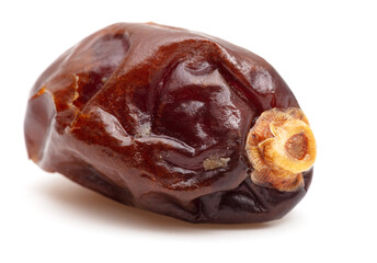 One dried date isolated on a white