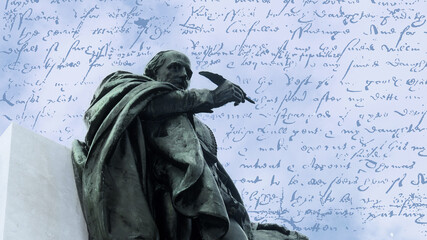 bronze memorial statue of William Shakespeare, who stands with pen in hand. The sky and his writings in the background. - obrazy, fototapety, plakaty