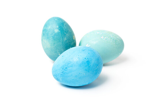 Easter eggs are blue on a white background. The concept of Celebrating Easter, staining eggs at home. Happy easter
