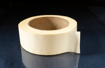 A roll of duct tape made of paper on the table.