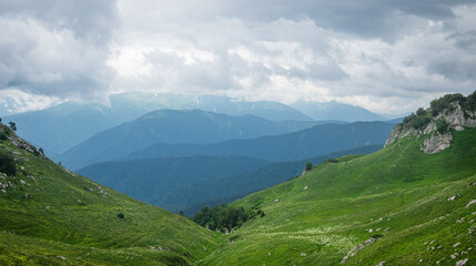 summer landscape panoramic view on a cloudy day in the valley mountains. Adygea, Russia
