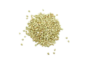 Pile of buckwheat isolated on white background. Green raw buckwheat grain top view.