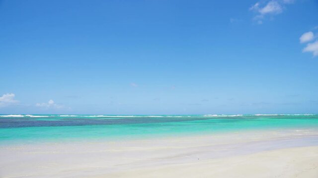 Clear beach 4k landscape. Blue sea and beach with white sand. Vacation on Maldive seashore, nobody, copy space.