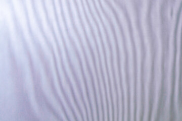 abstract colored wavy background of interference overlay fine meshes, combination of light and shadow, toning