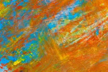 colorful creative motley background: smudged residues of oil paints on a wooden palette, short...