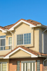 The top of the house or apartment building with nice window.