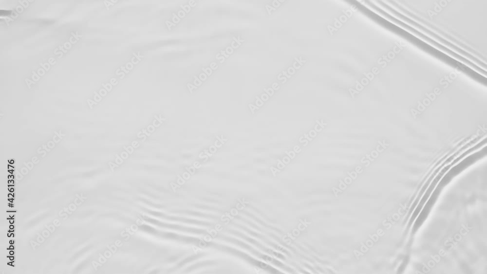 Poster up close, top view, slow motion various waves of the water surface hitting the sun's rays, making th