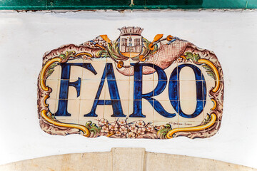 Traditional sign made of painted tiles, train station in Faro, Algarve, Portugal