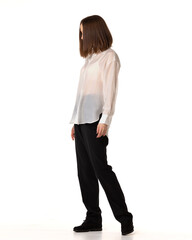 Girl wear black classic pants, and white shirt. Fashion studio portrait of young elegant woman. Fashion portrait, look book and catalogue style. Woman looks proud and arrogant.
