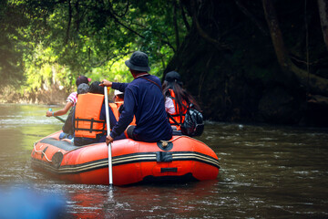 Group of tourists rafting on the water stream river that lead to Thi Lor Su waterfall, Umphang, Tak...