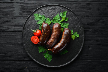 Baked blood sausage. Buckwheat sausage. Top view. Free space for your text.