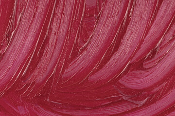 Liquid lipstick cosmetic. Purple cosmetics smear pattern background. Marsala beauty product sample closeup. Pink swatch matt backdrop. Makeup creamy texture. Creamy stroke
