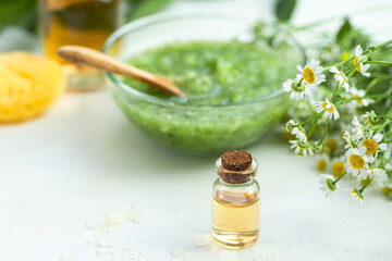 Concept of natural organic ingredients in cosmetics. Essential oil, extract of fruits and vegetables. Natural moisturizing body, face care. Camomile essence for healthy young skin. Copy space close up