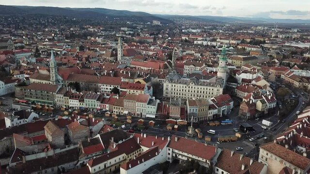 Cinematic aerial drone footage of the medieval fire tower and charming quaint historical inner city, downtown of Sopron, a major tourist destination in Győr-Moson-Sopron County in Northwestern Hungary