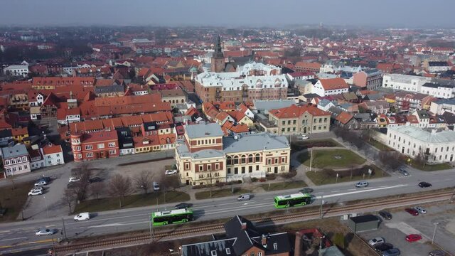 Aerial view drone shot of Ystad - view of a church and road with cars