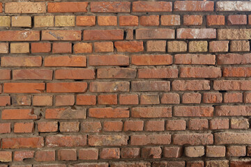Background of very old red brick wall, close-up ancient texture.